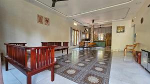 a large living room with a table and chairs at Aadhya Serenity - Private Villa near Ecobeach Honnavar in Honāvar