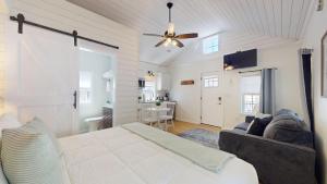 a bedroom with a bed and a couch in a room at Coastal Estate in Cape May
