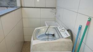 a small bathroom with a toilet in the corner at Ap cobertura próx Vila Militar, Afonsos e CEFAP in Rio de Janeiro +16 photos