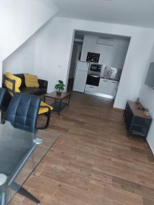 a living room with a couch and a table at Apartamentos vacacionales malba Bajo A in Punta Umbría