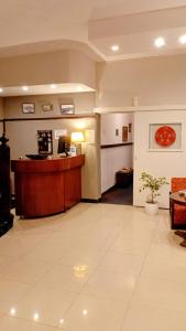 a lobby of a hotel with a desk and a room at Hostal del Sur in Mar del Plata