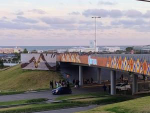 a bridge over a road with a car on it at Hostal del Sur in Mar del Plata