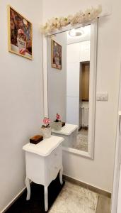 a bathroom with two sinks and a mirror at Royal Apartman in Banja Koviljača +36 photos