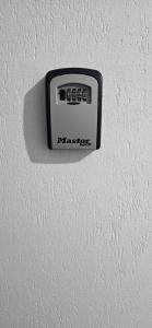a black and white object on a white wall at Paula in Curtea de Argeş