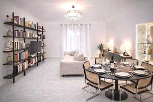 a living room with a table and a couch at Sorrento Downtown in Sorrento
