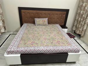 a bed in a room with at Dj's home stay in Jodhpur