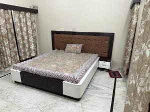 a bedroom with a bed in a room at Dj's home stay in Jodhpur