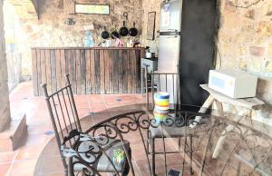 a kitchen with a glass table and a refrigerator at Rancho alegre in Jocotepec