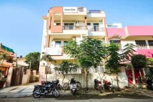 a group of motorcycles parked in front of a building at DG Hotel Green Vista in Jaipur +6 photos