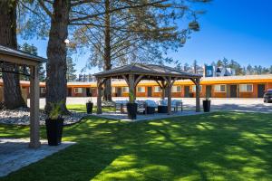 a gazebo with tables and benches in a park at The Tide's Out in Parksville