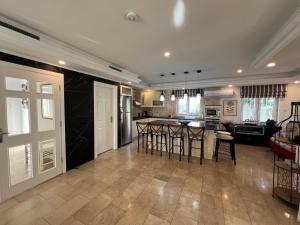 a kitchen with a table and some chairs in it at VillaBelek in Belek