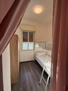a bedroom with a bunk bed and a window at Residence Toscano in Palmi +74 photos