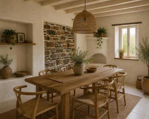 a dining room with a wooden table and chairs at Palokastro House Quiet Village Stay with Terrace in Samos