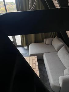a view of a living room with a couch at A frame Miška in Nána
