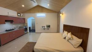 a large bedroom with a large bed in a kitchen at Sixtofifty Stays in Dharmsāla +37 photos