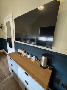 a kitchen with a counter with a coffee pot on it at Eurobar & Hotel in Oxford +47 photos