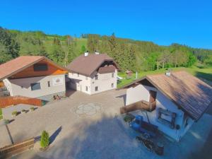 an overhead view of a house with a backyard at Burgbichl Apartments in Rothenthurn