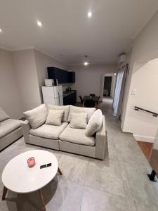 a living room with a couch and a table at APART-Esperanza in Esperanza