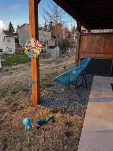 a yard with a bench and birds on the ground at Private Spacious Walkout Suite Near Downtown in Halifax