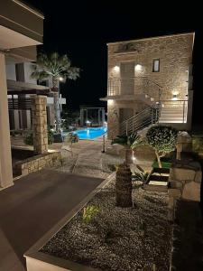 a house with a swimming pool at night at Xasteria in Elafonisi