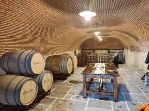 a room with a bunch of wine barrels in it at Enoturismo-Noja in Noja