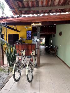 two bikes parked in front of a restaurant at Pousada Acquarela Paraty -a 450 mts do centro historico! we also speak English in Paraty