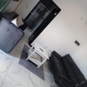 an overhead view of a living room with a couch and a table at Oregano Estate in Swakopmund