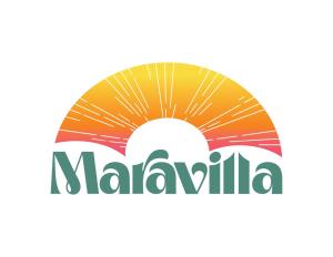 a symbol of malaya with the sun behind the clouds at Maravilla in Taos