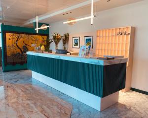 a lobby with a blue and green counter top at Green Park Hotel in Peschiera del Garda +59 photos