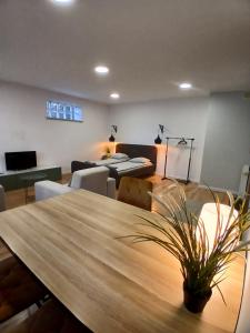 a dining room with a wooden table and chairs at Pokoje w Centrum - Parking - Rowery in Sopot