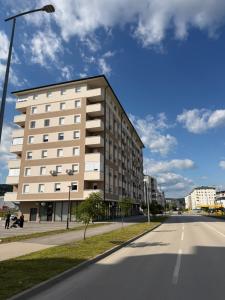 a large building on the side of a street at Apartman Premium in Doboj