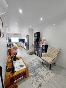 a living room with a couch and a table at Casa do Frade in Abrantes