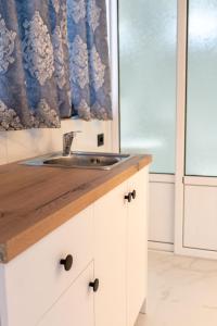 a kitchen with a sink and a window at Villa Bella in Ksamil +159 photos