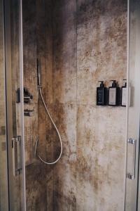 a bathroom with a shower with two soap bottles at Portico Provenzali in Cento +112 photos