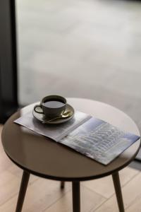 a cup of coffee sitting on top of a table at Marina Club in Batumi