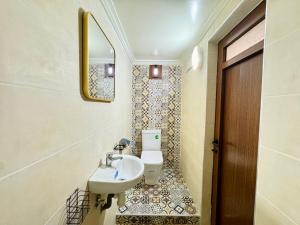 a bathroom with a sink and a toilet at Marrakech ferme lodge in Marrakesh