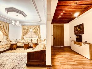 a living room with a couch and a table at Marrakech ferme lodge in Marrakesh