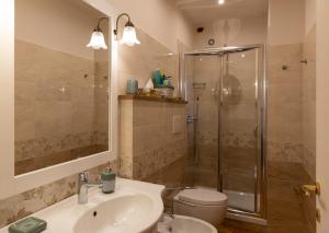 a bathroom with a shower and a sink and a toilet at Casa Angolo delle Rose 2 in Orvieto