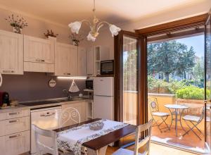 a kitchen with a table and a dining room at Casa Angolo delle Rose 2 in Orvieto +15 photos
