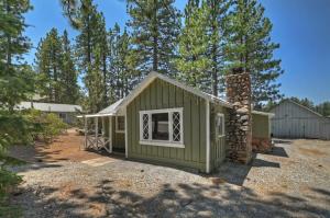a green tiny house in a yard with trees at Applewood Cabins & Guest Cabin Near the Village in Big Bear Lake