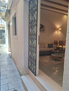 an open door to a patio with a couch at Dalti Center Apartment in Zadar