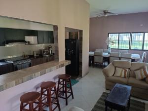 a kitchen and living room with a couch and a table at Finca la Esperanza in Guadalupe