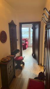 a living room with a room with a couch at La Sibilla in Riscone