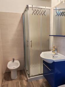 a bathroom with a shower and a toilet and a sink at Monolocale Belvedere in Bovec +22 photos