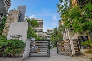 a gate in front of a building with a fence at The Zean Luxury in Jāmb