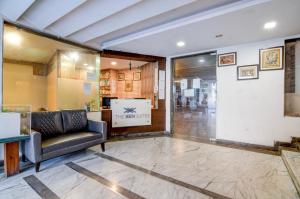 a lobby with a couch and a glass door at The Zean Luxury in Jāmb +69 photos