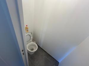 a small bathroom with a toilet in a room at Kougou Ruz in Audierne +18 photos