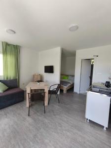 a living room with a couch and a table at Villa Hristina in Elshani