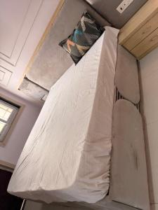 a mattress hanging from the ceiling of a room at Sunrise stay in Chhatikara