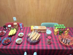 a table with a red checked table cloth with food on it at Air Jinju in Jinju +16 photos